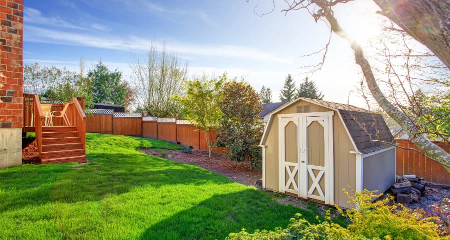 Fenced backyard with storage shed in Palm Springs